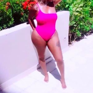 Pink one piece. Worn once in great condition.